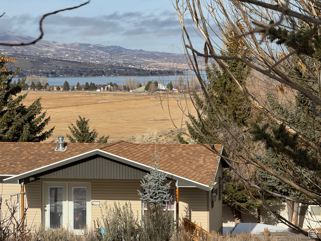 Mountain view featuring a water view