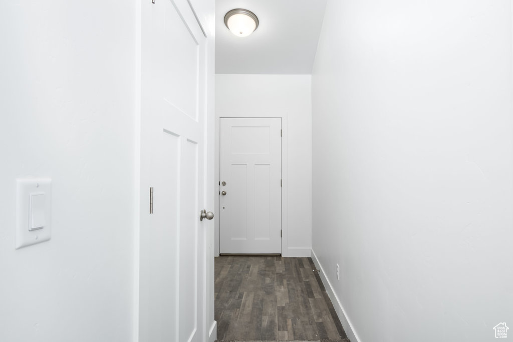 Corridor featuring dark hardwood / wood-style flooring