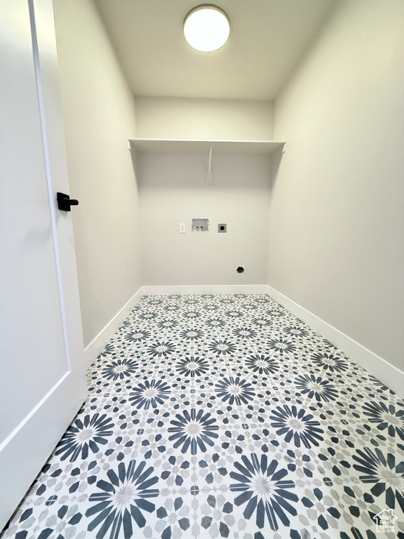 Laundry room featuring tile patterned flooring, electric dryer hookup, and hookup for a washing machine