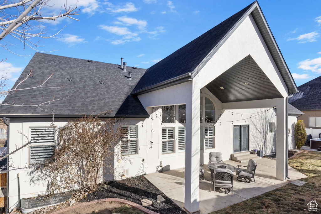 Rear view of house with a patio area