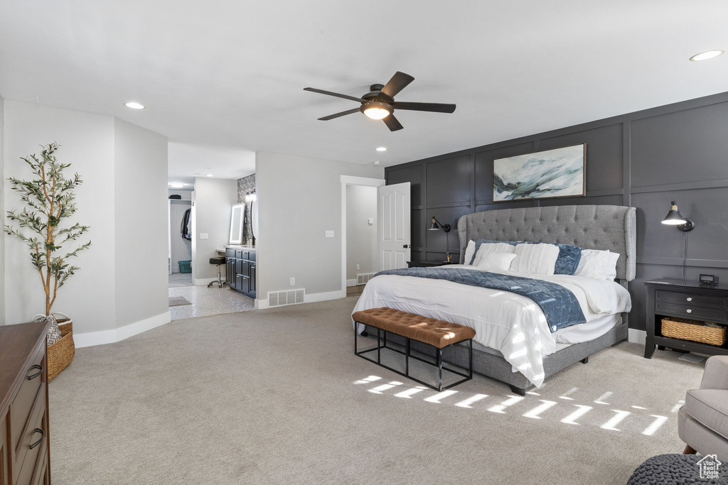 Carpeted bedroom with ceiling fan