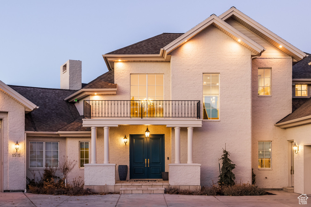 View of front of home with a balcony