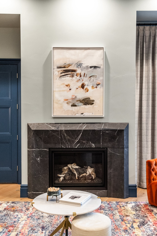 Detailed view of a high end fireplace and wood finished floors