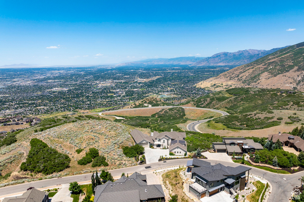 Aerial perspective of suburban area with a mountainous background