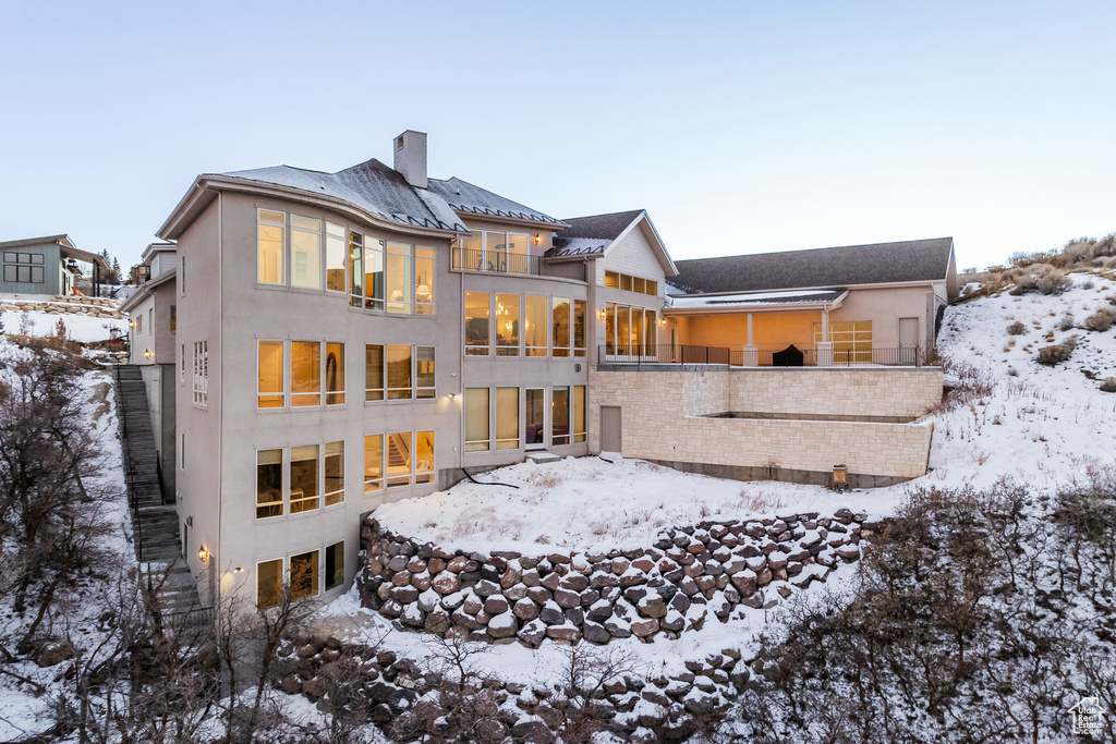 View of snow covered property