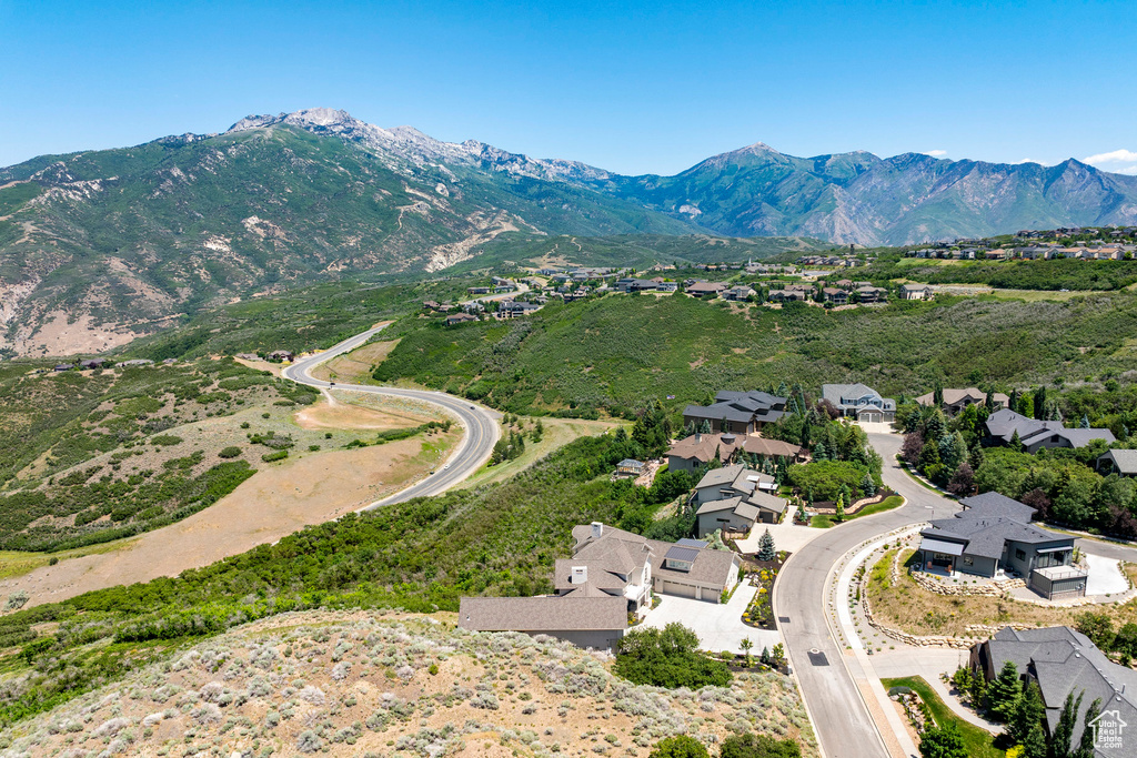 Aerial perspective of suburban area with a mountainous background
