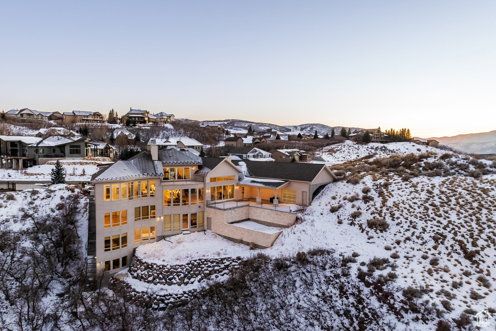 Snowy aerial view featuring a mountain view