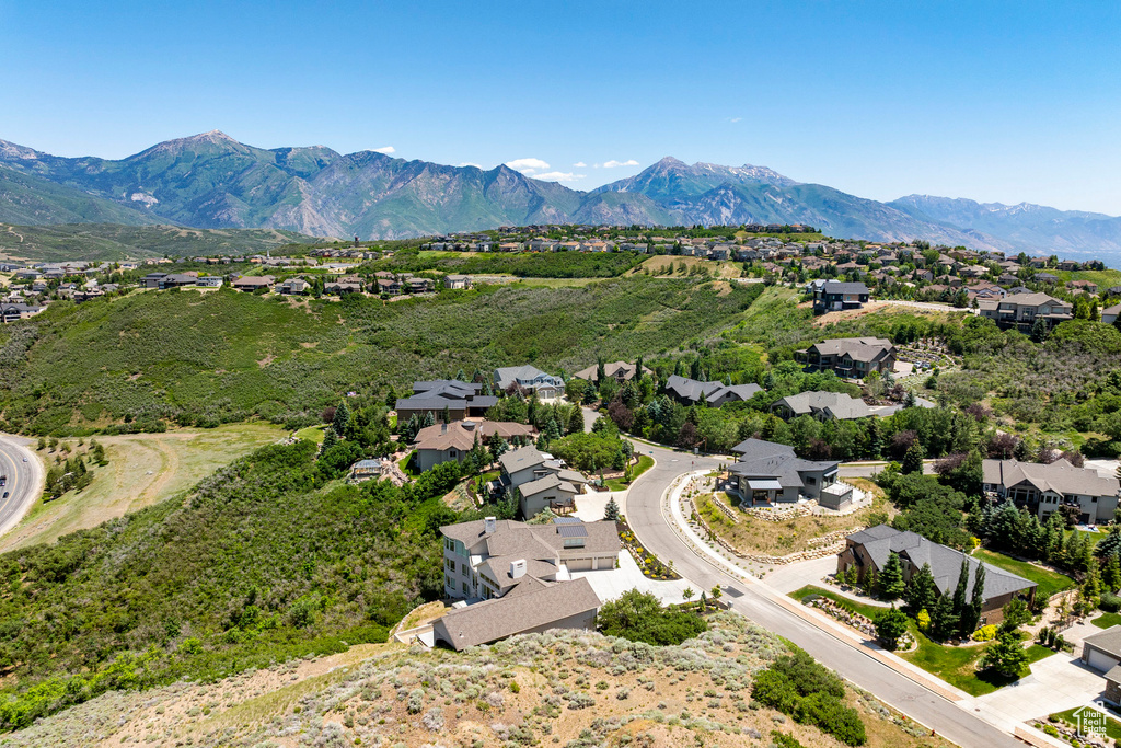 Aerial perspective of suburban area with a mountain backdrop