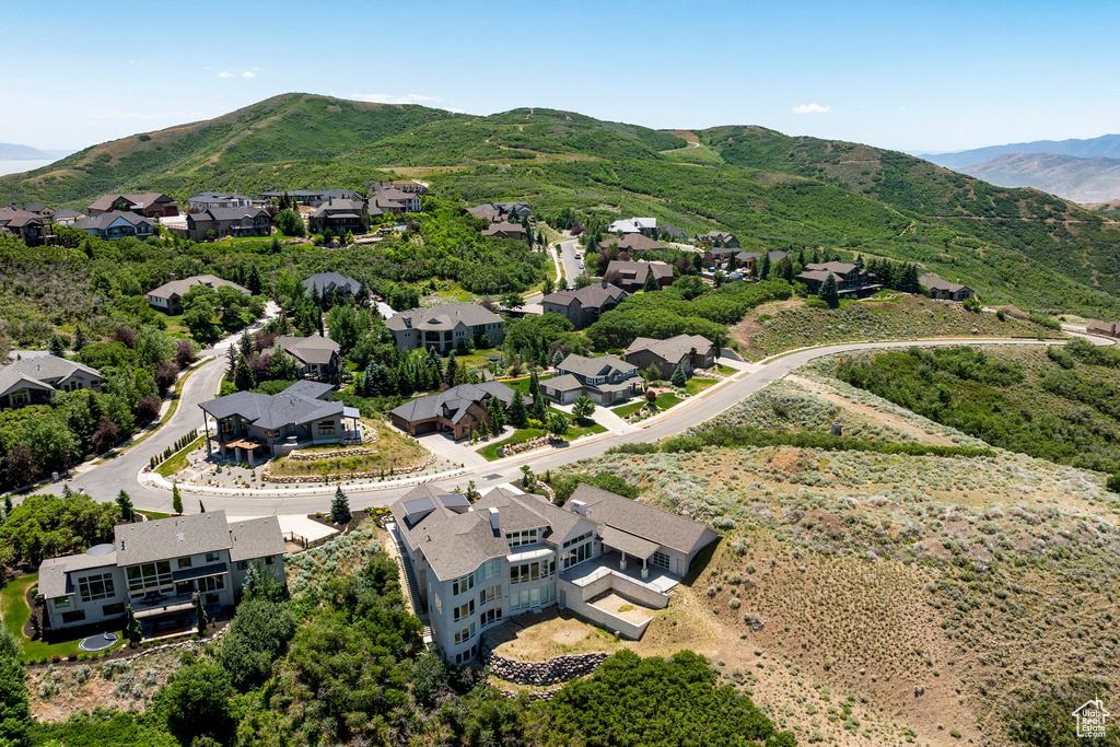 Aerial view of residential area featuring a mountain backdrop