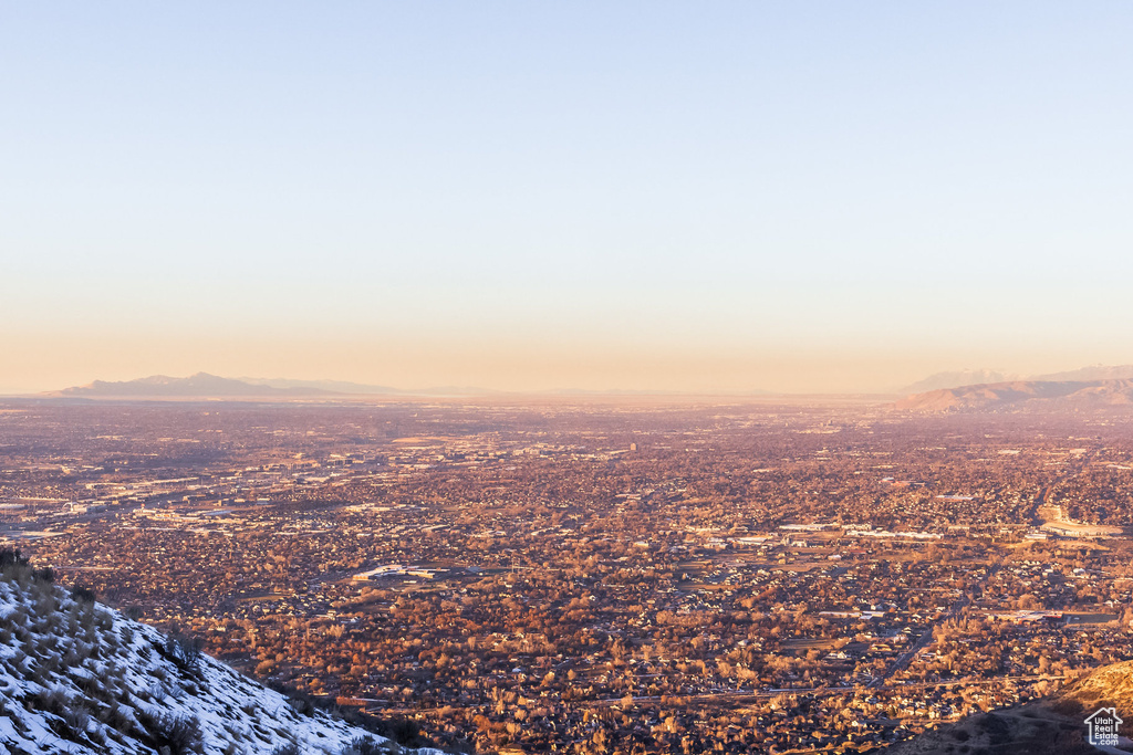 Aerial view at dusk featuring a mountain view
