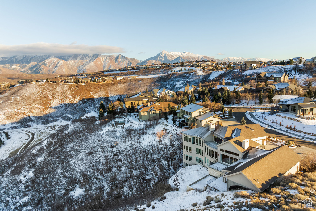 Snowy aerial view featuring a mountain view
