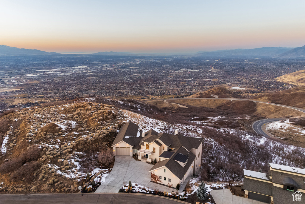 Snowy aerial view featuring a mountain view