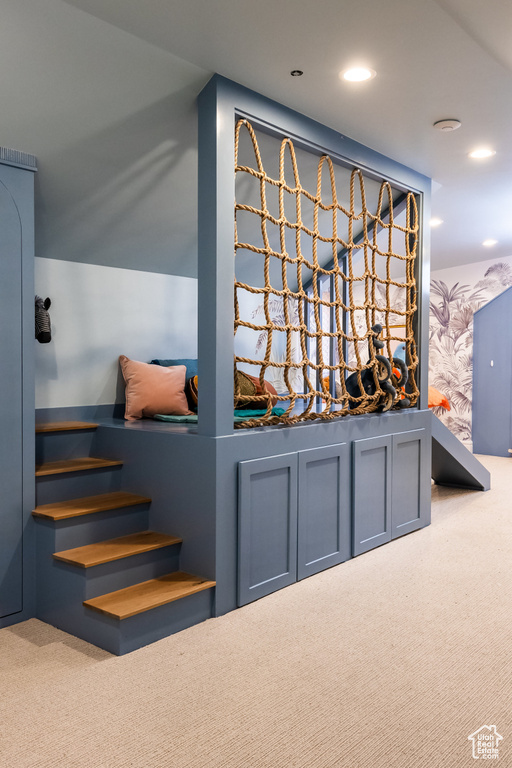 Detailed view of carpet and recessed lighting