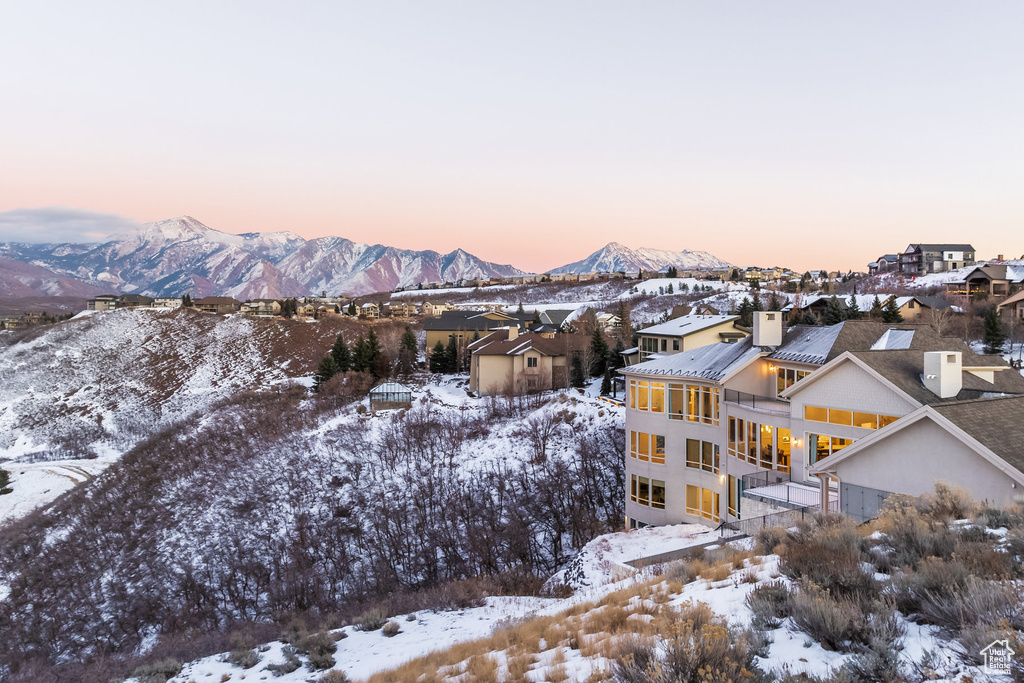 Snowy aerial view featuring a mountain view