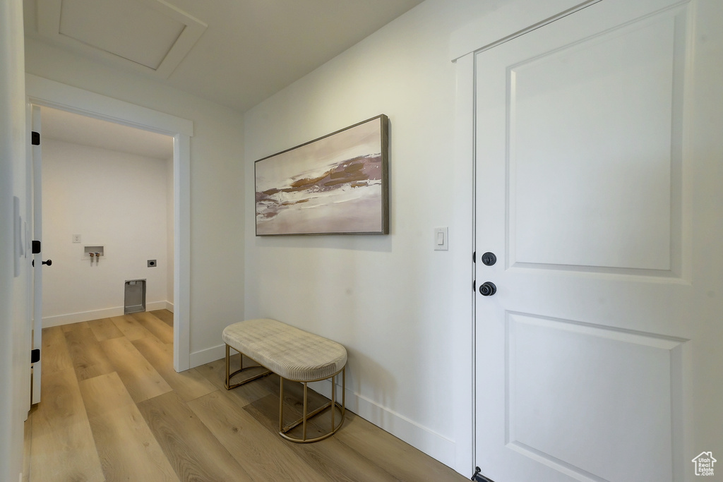 Corridor featuring light wood-type flooring