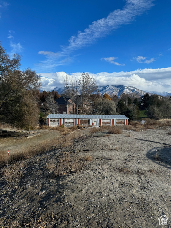 View of front of home featuring a mountain view and a rural view