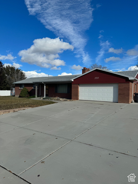Ranch-style house featuring a garage