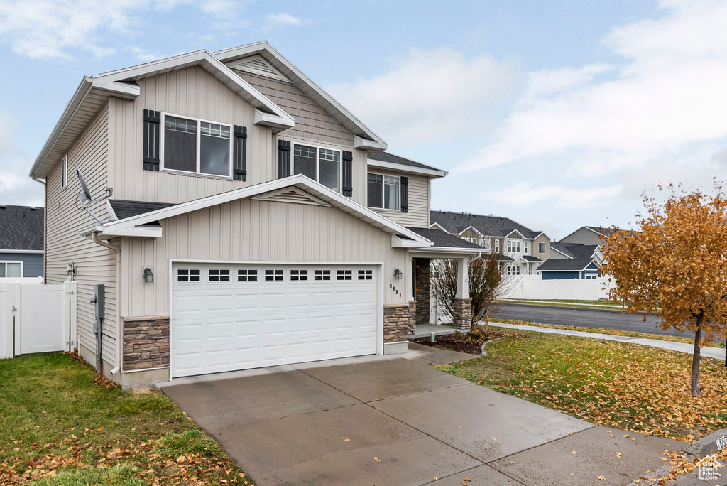 View of front of property featuring a garage