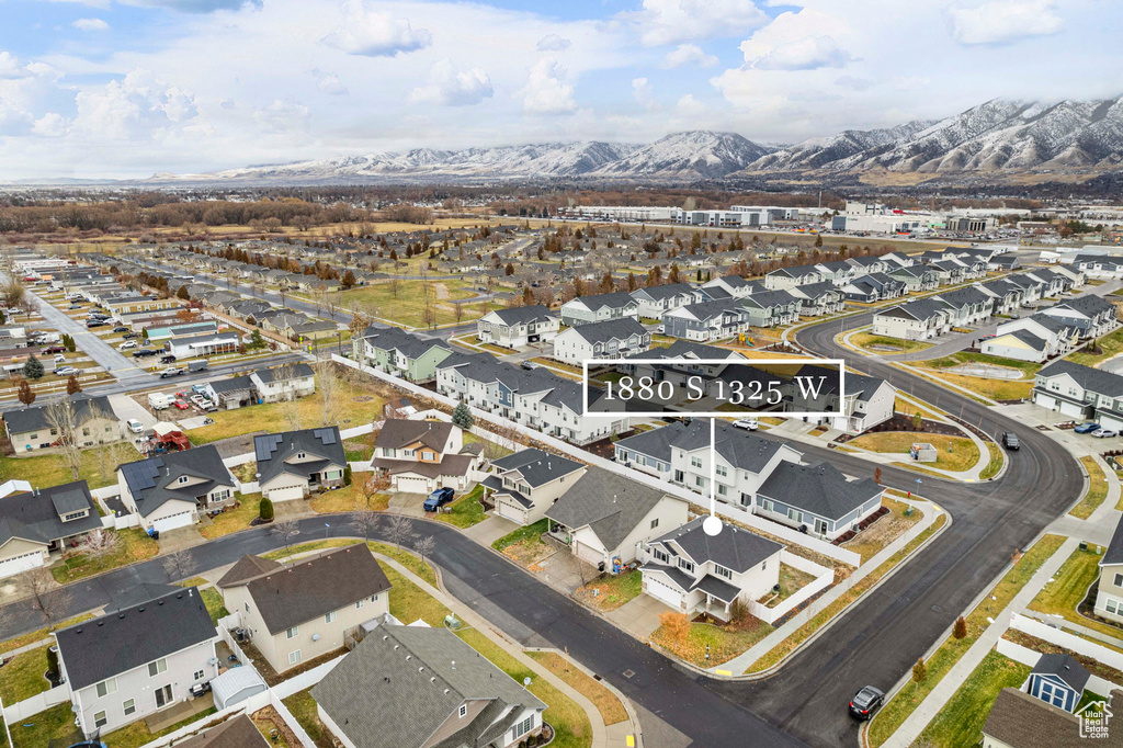 Birds eye view of property with a mountain view