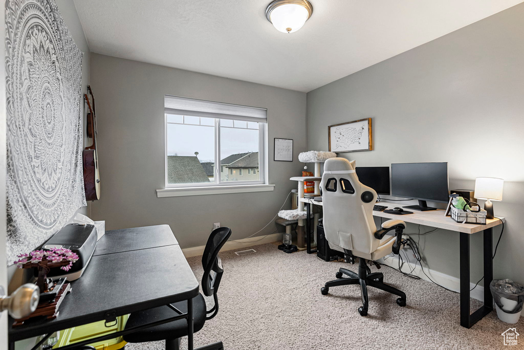 View of carpeted home office