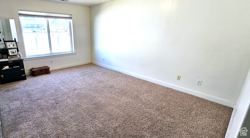 Spare room with carpet flooring and baseboards