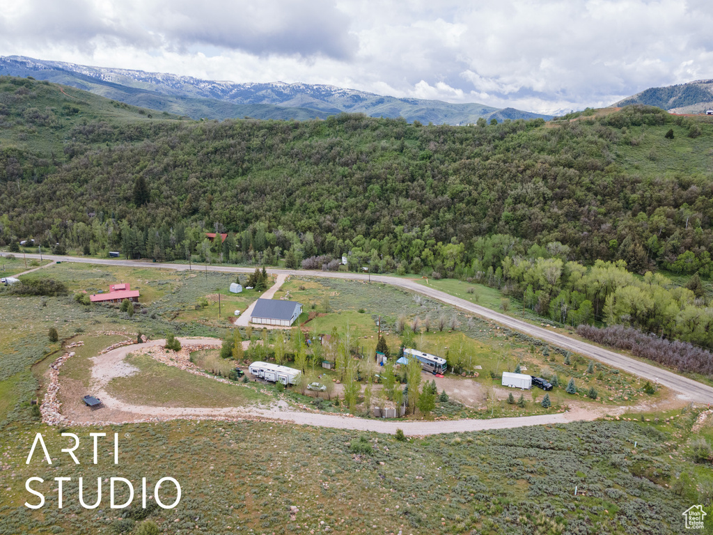Aerial view of a heavily wooded area and mountains