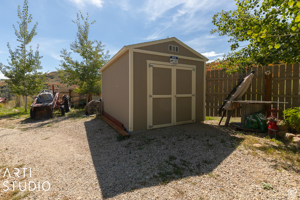 View of shed with fence