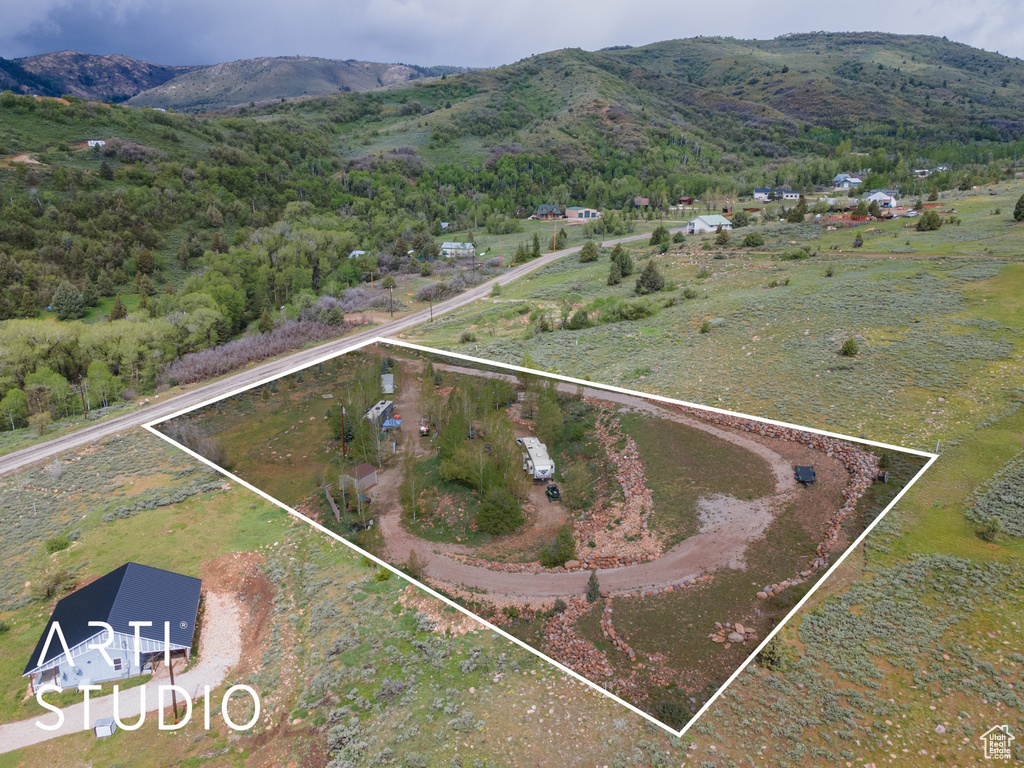 View of property location with mountains, property boundaries highlighted, and rural landscape