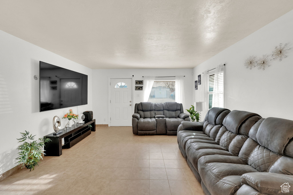 Living room featuring light tile patterned floors