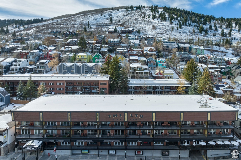 Snowy aerial view featuring a mountain view