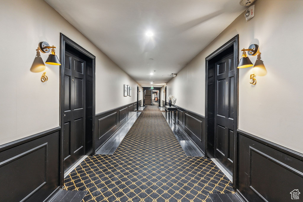 Hallway with dark carpet