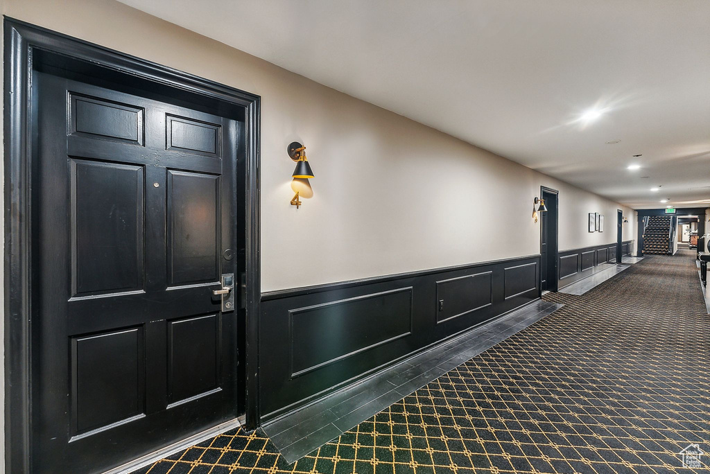 Hallway with dark carpet