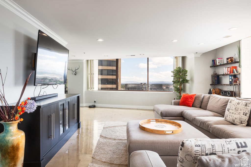 Living room featuring crown molding