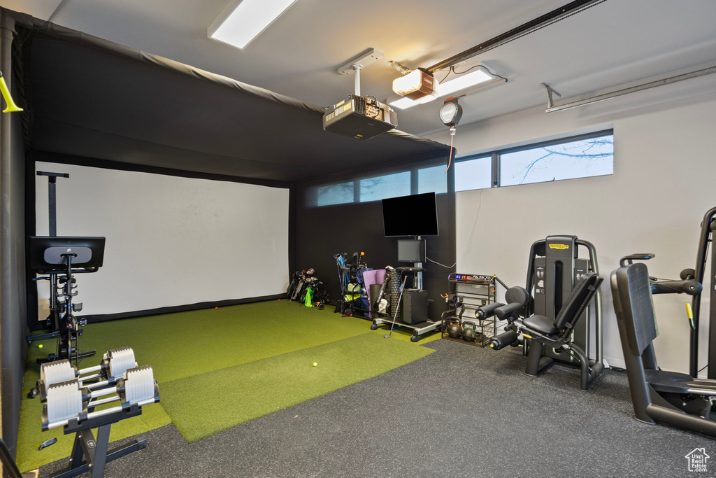 Game room featuring golf simulator