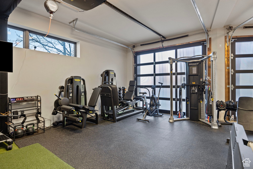 Exercise room with plenty of natural light and a garage
