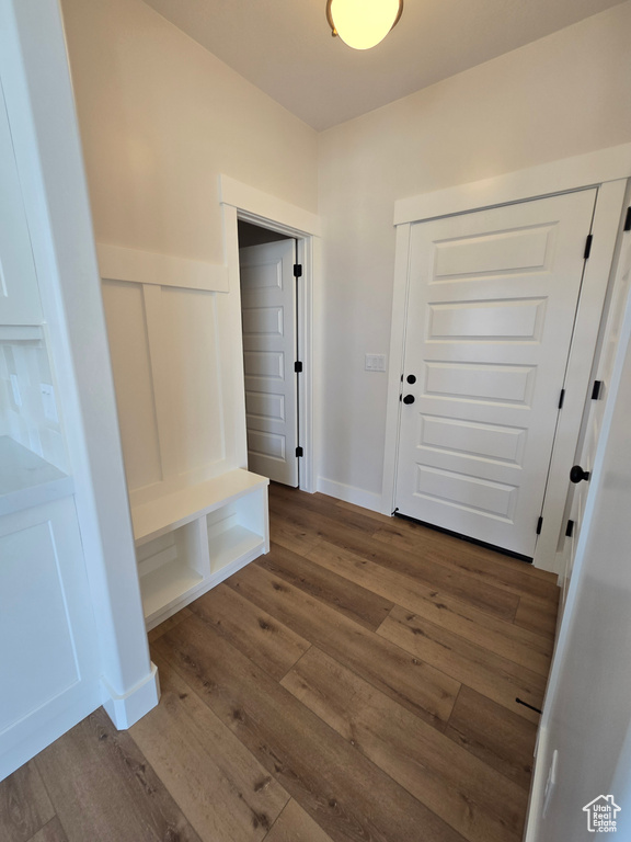 Mudroom with wainscoting and wood finished floors