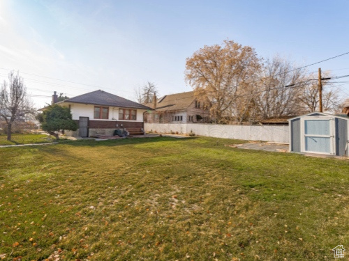 View of yard featuring a storage shed