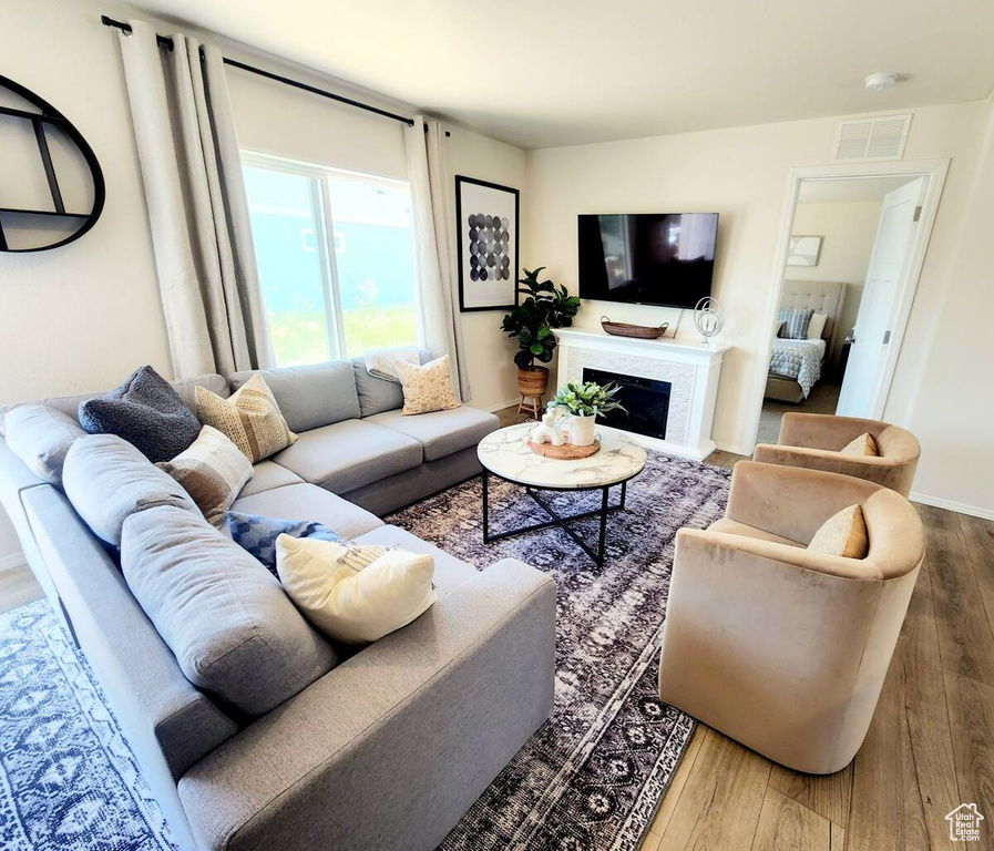 Living room with hardwood / wood-style floors