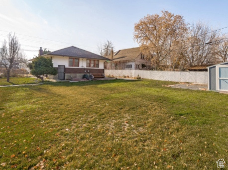 View of yard with a storage shed