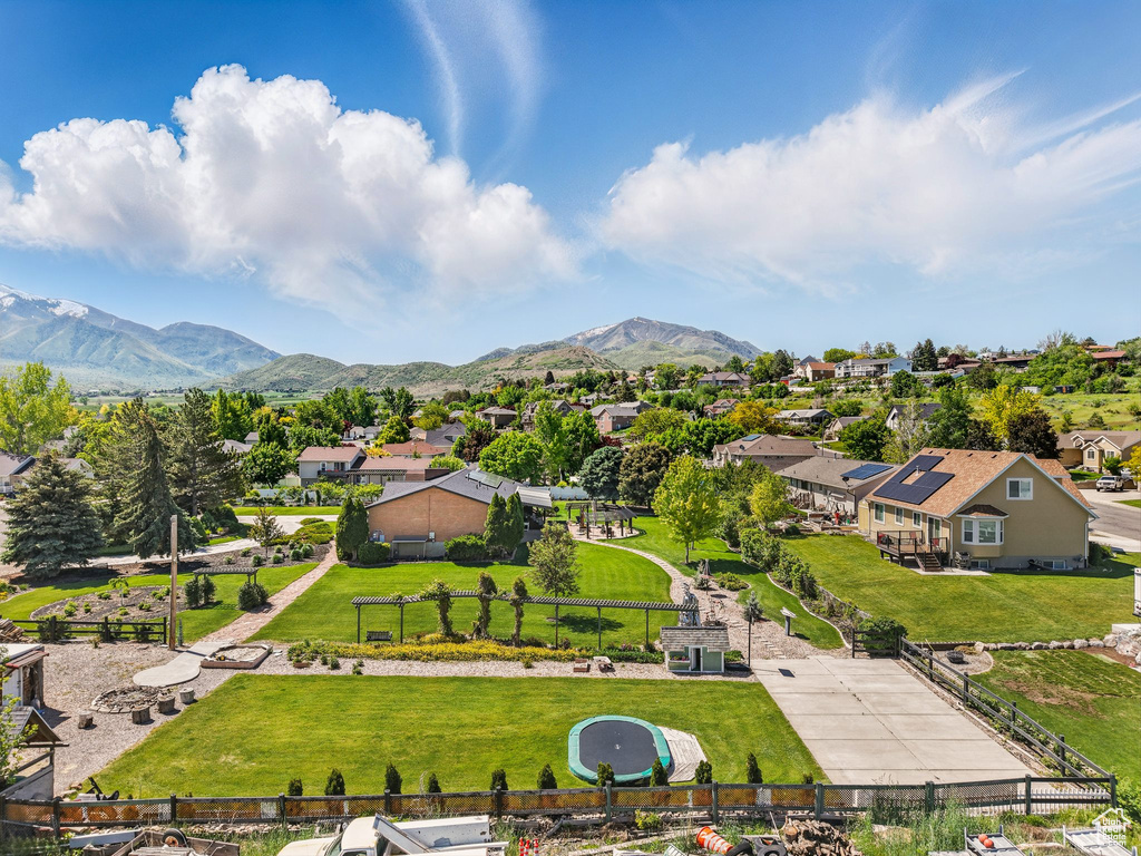 Aerial perspective of suburban area featuring a mountainous background