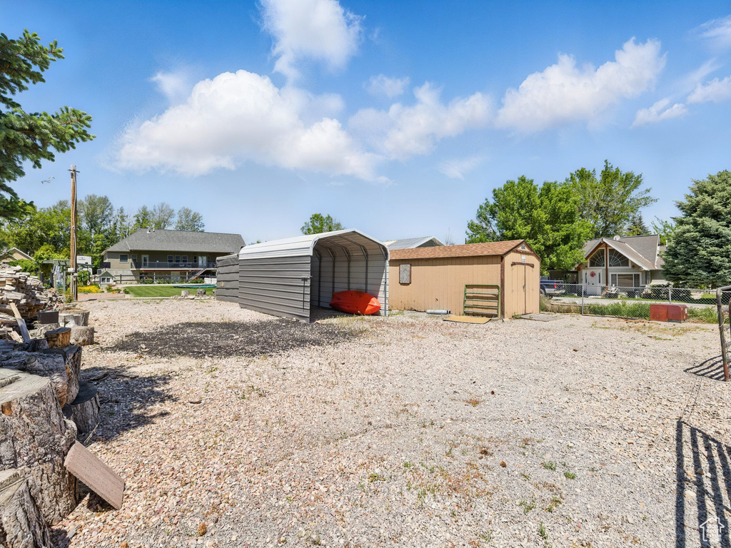 View of yard with a carport
