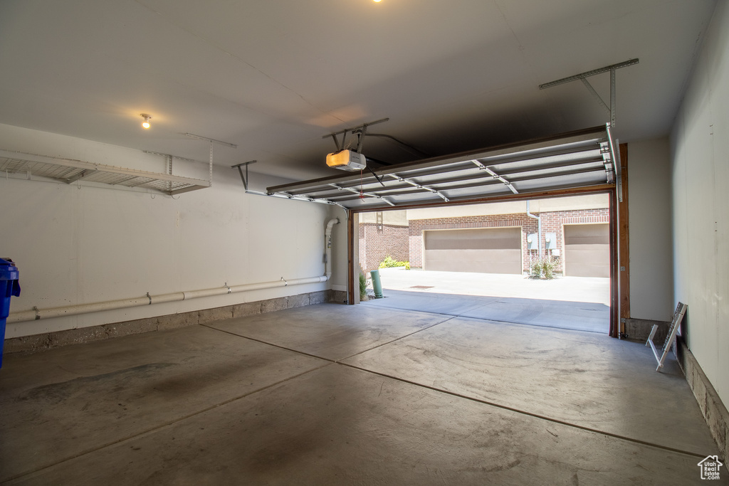 Garage featuring a garage door opener