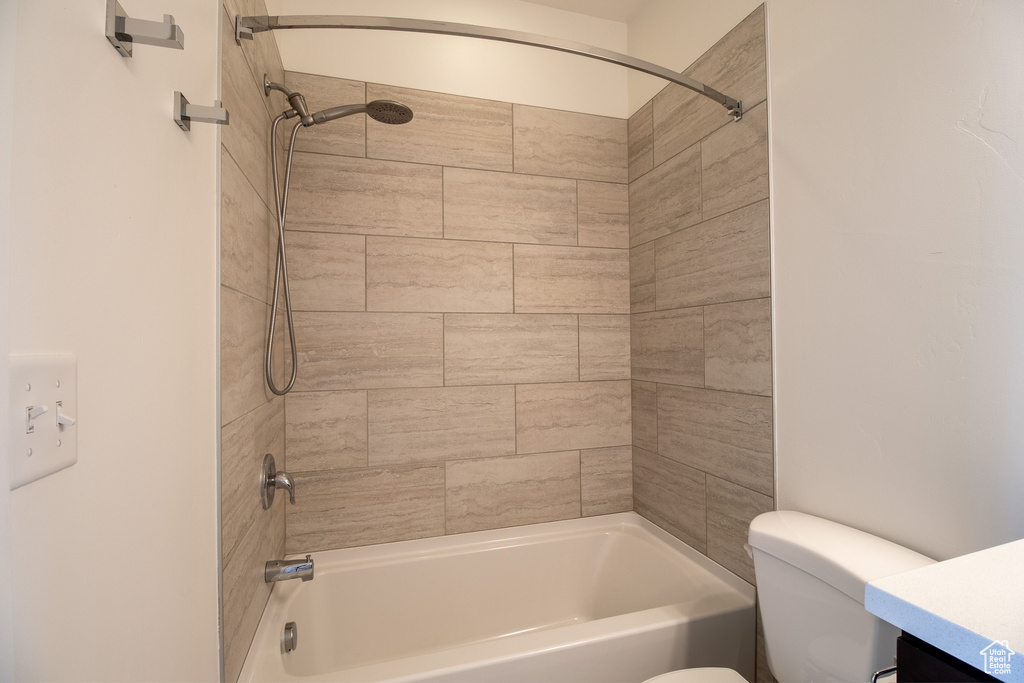 Bathroom featuring bathtub / shower combination and vanity
