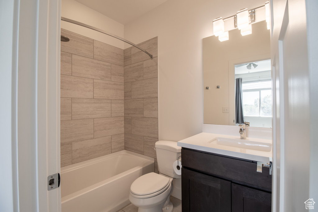 Full bath with vanity and shower / bath combination