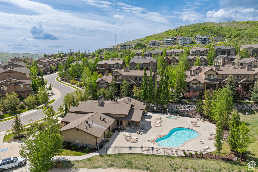 Aerial view of residential area featuring a pool area