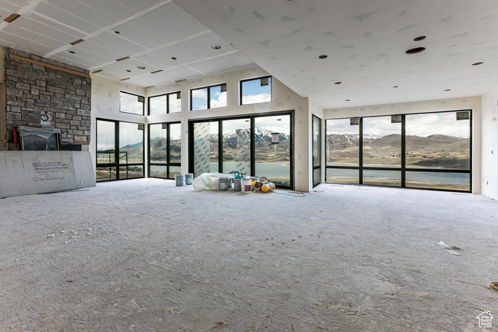Unfurnished living room featuring carpet floors