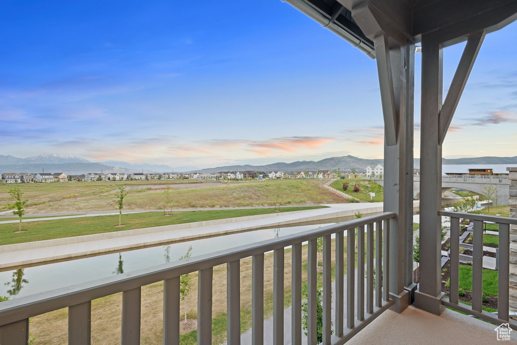 Balcony at dusk with a mountain view