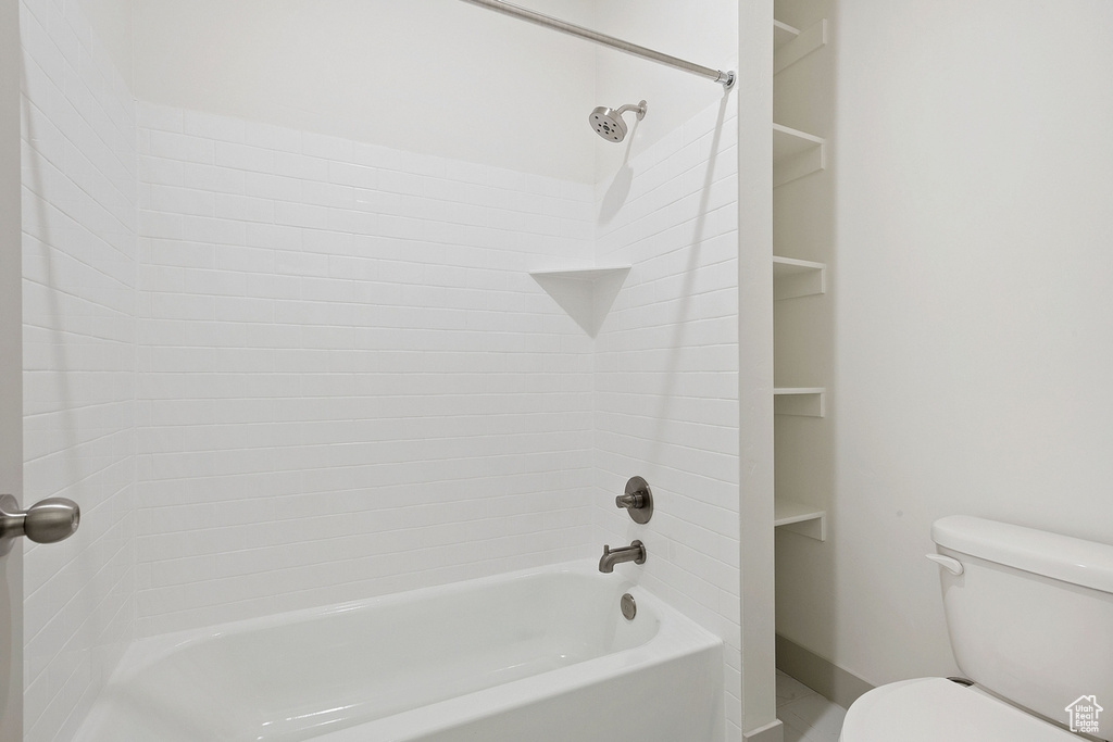 Full bathroom featuring toilet and  shower combination
