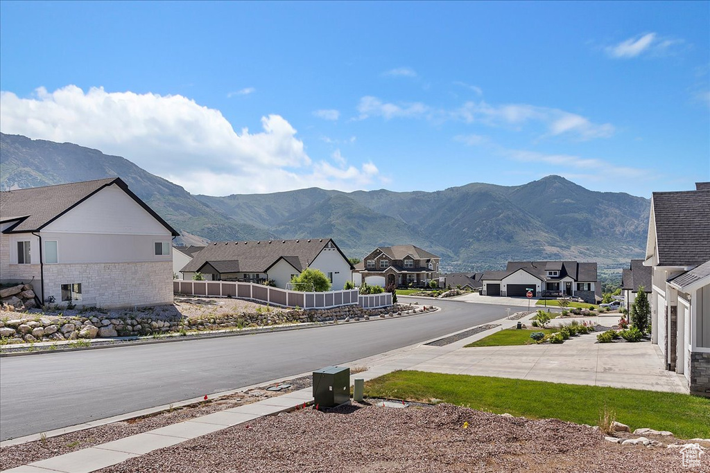 View of mountain backdrop featuring nearby suburban area