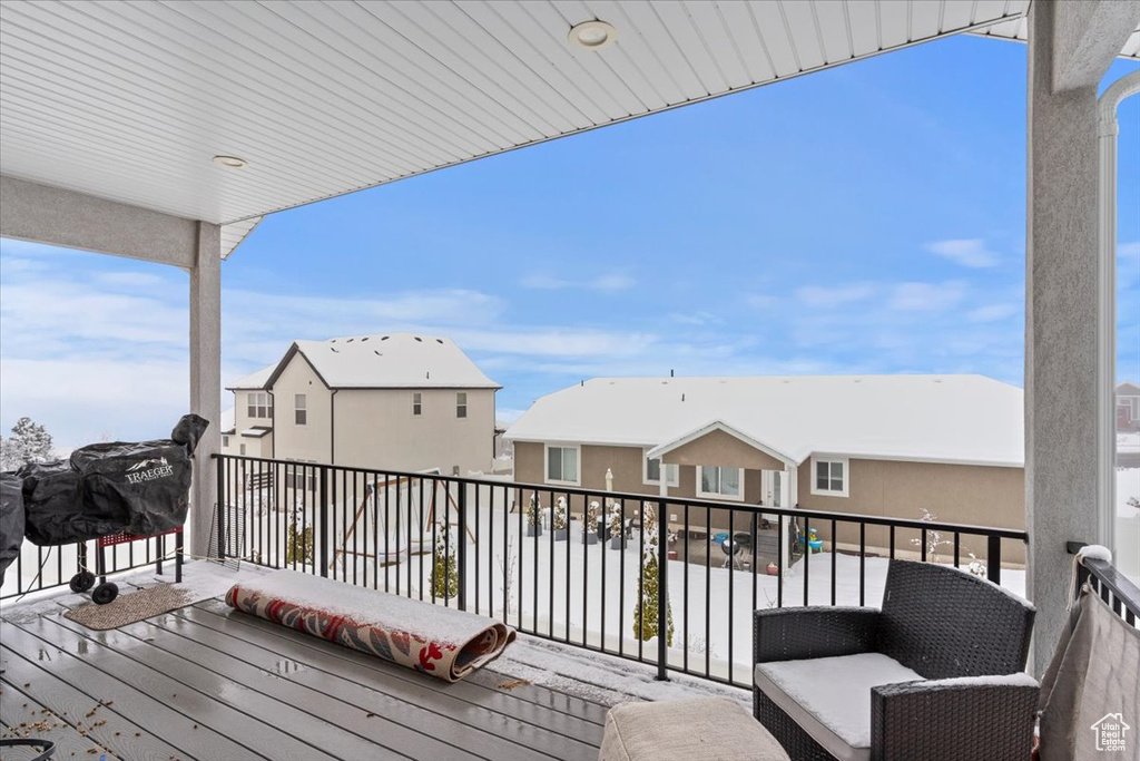 Wooden terrace featuring a residential view